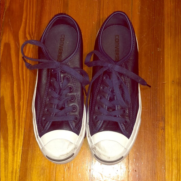 brown and blue leather converse